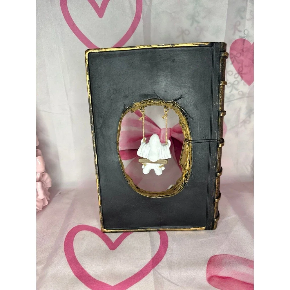 Halloween Ghost Swinging on Tree inside a book